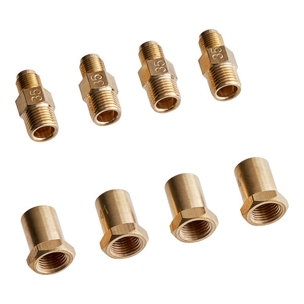A group of brass threaded fittings.
