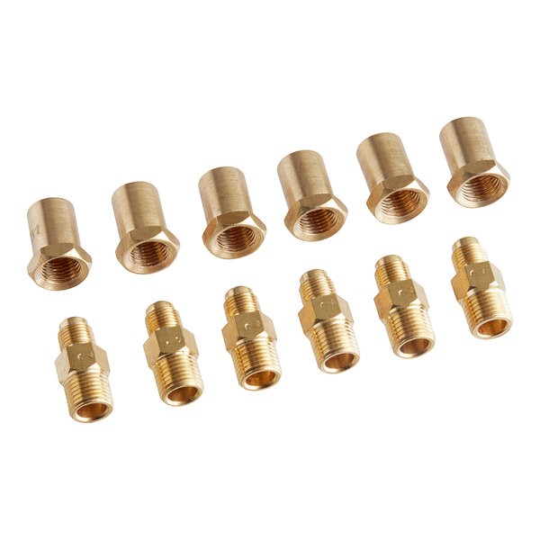 A group of brass threaded fittings including a nut and pipe.