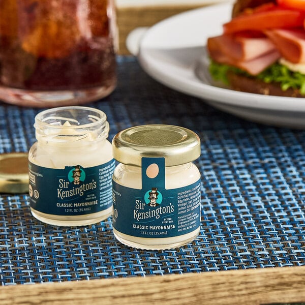 A small 1.2 oz. single-serve jar of Sir Kensington's Classic Mayonnaise.