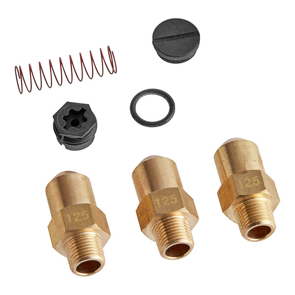 A black object with a group of brass fittings and a spring.