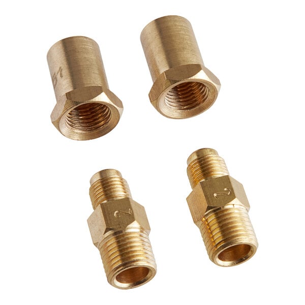 A white background with three brass threaded fittings and nuts.