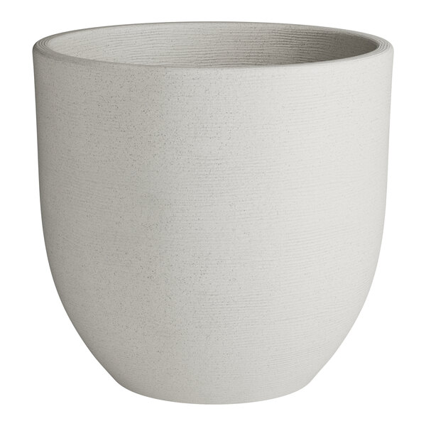 A gray round planter with a curved edge.