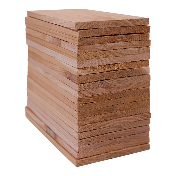 A stack of Wildwood Grilling cedar wood planks.