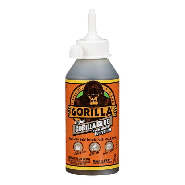 A bottle of Gorilla Glue with a white cap.