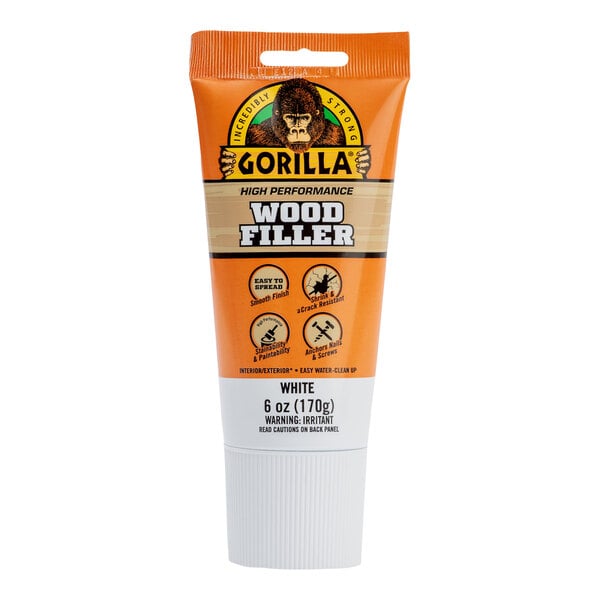 A 6 oz tube of Gorilla White Wood Filler with a gorilla on the box.