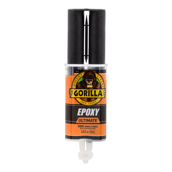 A black and orange Gorilla epoxy syringe with black and yellow text.