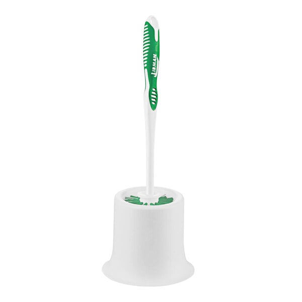 A white toilet brush holder with a green Libman round toilet brush inside.