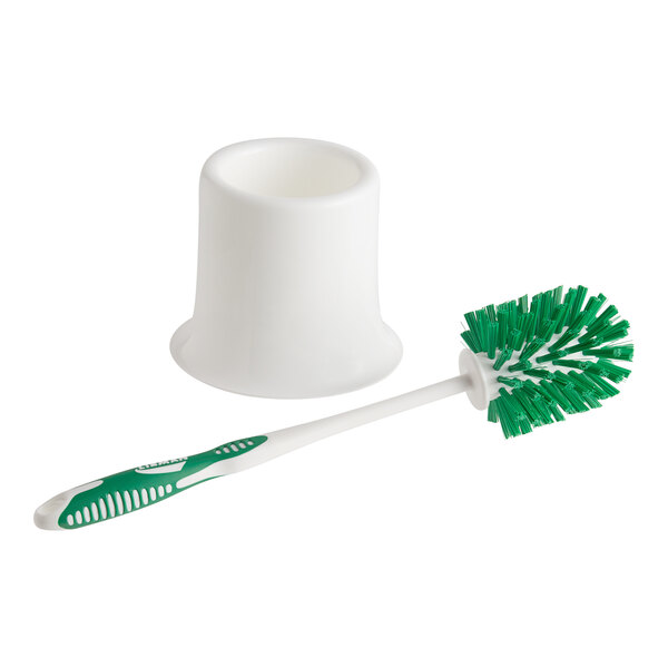 A white plastic cup with a green and white Libman toilet bowl brush inside.