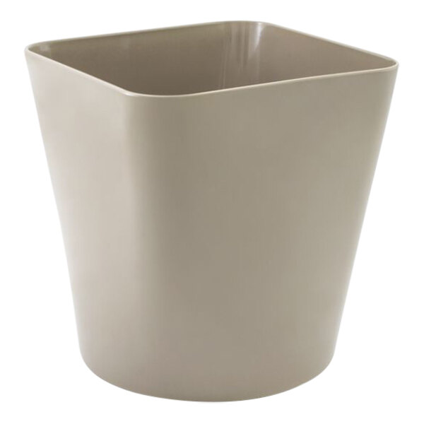 A close up of a beige bamboo fiber wastebasket with a flare top.