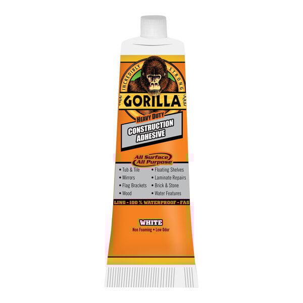 A white tube of Gorilla Heavy-Duty Construction Adhesive with an orange cap.