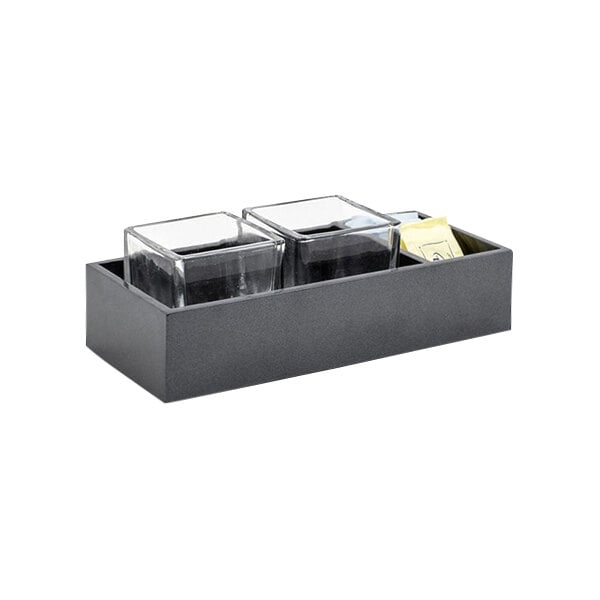 A black tray with three square glass containers inside a black room360 New York onyx resin organizer.