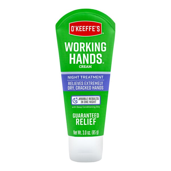 A green and white tube of O'Keeffe's Working Hands Night Treatment hand cream.