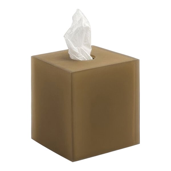 A nutmeg brown resin square tissue box cover with tissue on top.