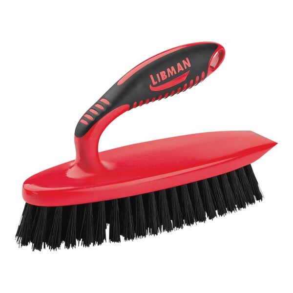 A red and black Libman iron scrub brush with a handle.