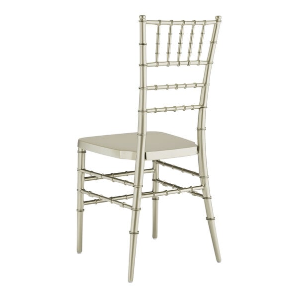 A silver Lancaster Table & Seating Chiavari chair with a white seat.