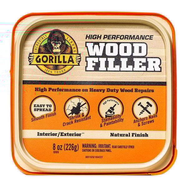 A tin of Gorilla Natural Wood Filler on a table.