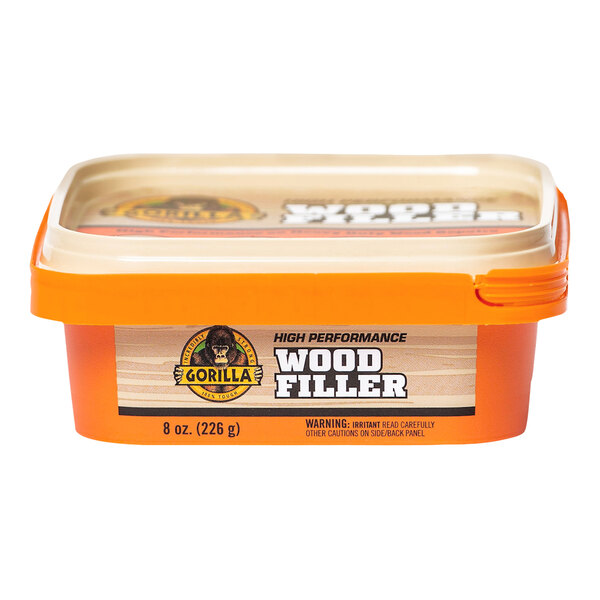 A plastic container of Gorilla Natural Wood Filler.