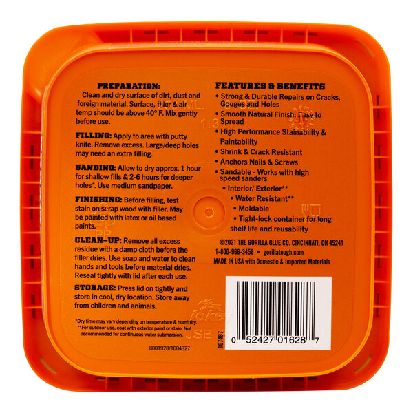 A close-up of a Gorilla 8 oz. plastic container of natural wood filler.
