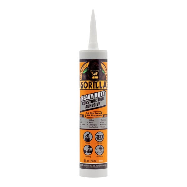 A white bottle of Gorilla Heavy-Duty Construction Adhesive with a yellow and black label.