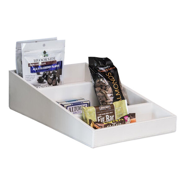 A white room360 faux leather coffee condiment organizer with food items inside.