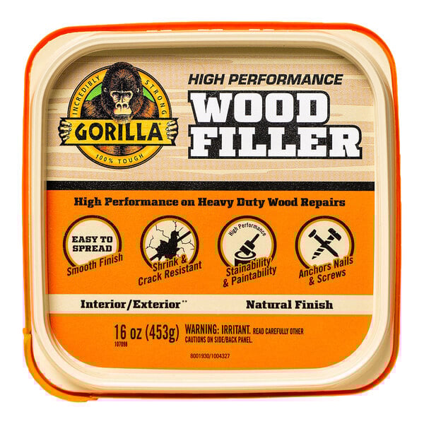 A plastic container of Gorilla Natural Wood Filler with a black and white logo.
