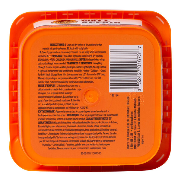 A close up of a Gorilla Wall Repair Spackling and Primer plastic container.