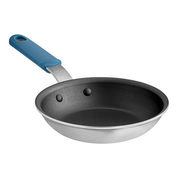 A Vigor A3000 Series aluminum frying pan with a blue silicone grip.