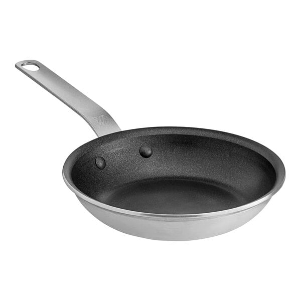 A close-up of a Vigor aluminum frying pan with a black non-stick coating and a plated handle.