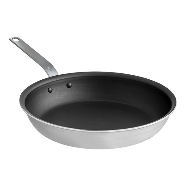 A close-up of a Vigor 12" aluminum frying pan with a plated handle and non-stick QuanTanium coating.