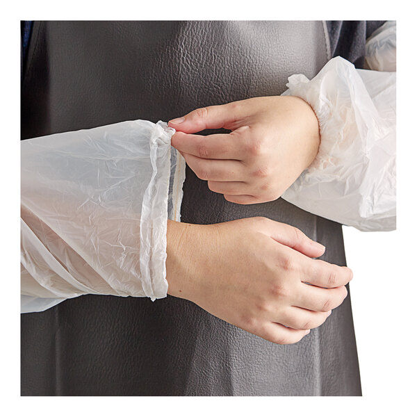 A person's hands putting on a Lavex clear plastic sleeve.