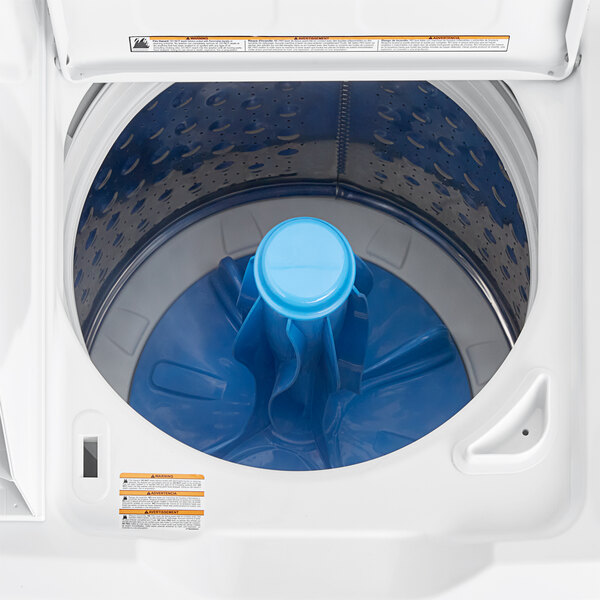 A white GE commercial washer with a blue lid and blue container.