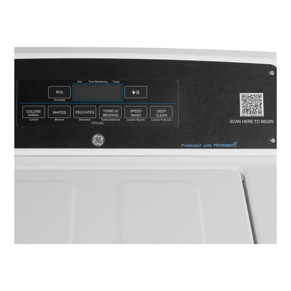 A GE top load commercial washer with a white background.