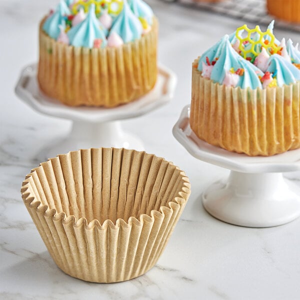 A Baker's Lane paper cupcake liner in a fluted design with a jumbo size.