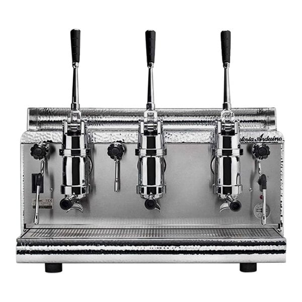 A chrome espresso machine with black handles and three spouts.