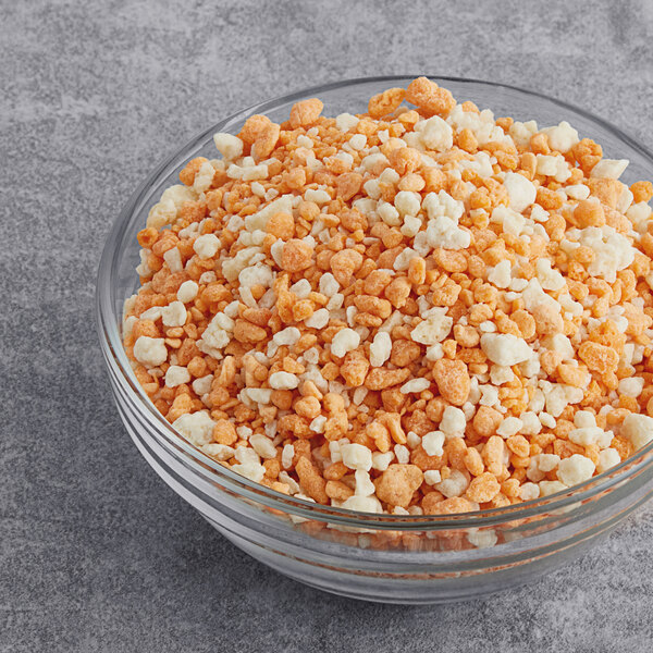 A bowl of popcorn with Yum Crumbs Orange Creamsicle crumb topping.