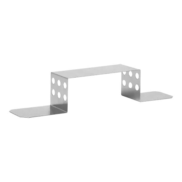 A white metal shelf with holes in it.
