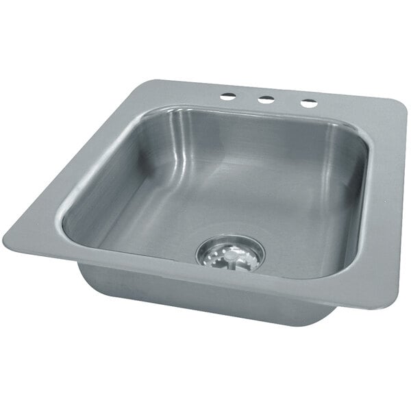 A close-up of a stainless steel Advance Tabco sink bowl with a drain.