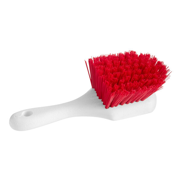 An O-Cedar red utility brush with a red handle.
