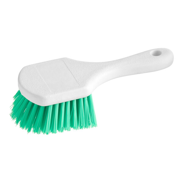 An O-Cedar green and white utility brush with green bristles.