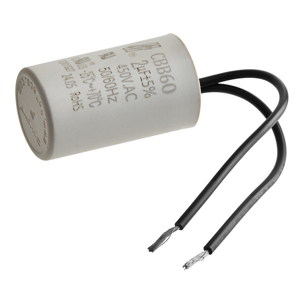 A close-up of a white Cooking Performance Group conveyor motor capacitor with black wires.