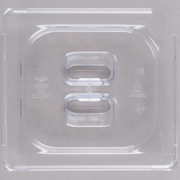 A clear plastic Vollrath Super Pan slotted lid with two holes.