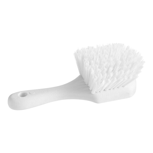 An O-Cedar white utility brush with a handle and bristles.