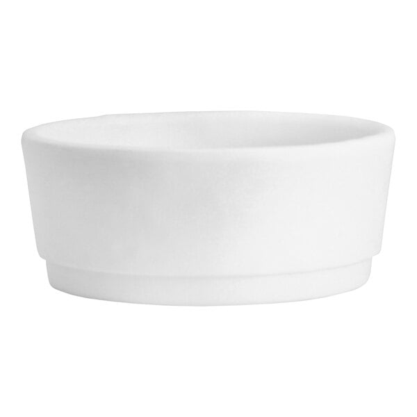 A white round dish with a white background.