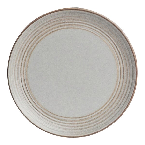 A white plate with brown lines on it.