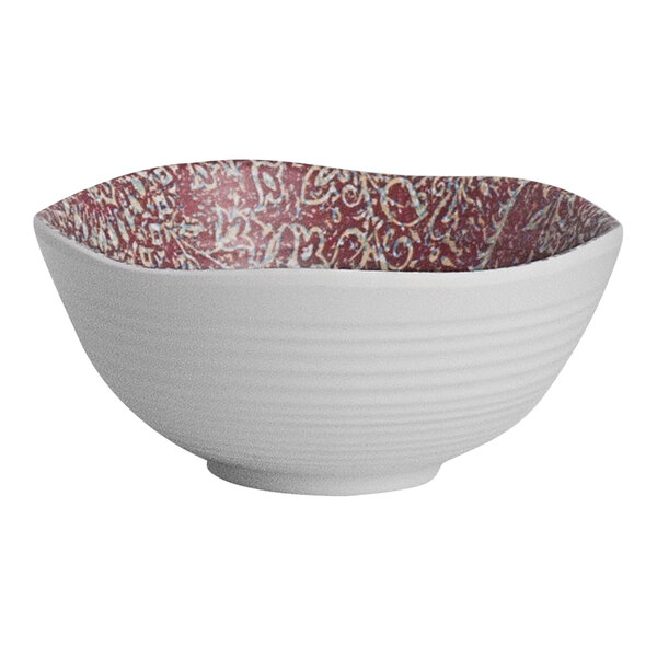 A white bowl with a red paisley design.