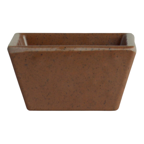 A brown speckled melamine square dish with a handle.