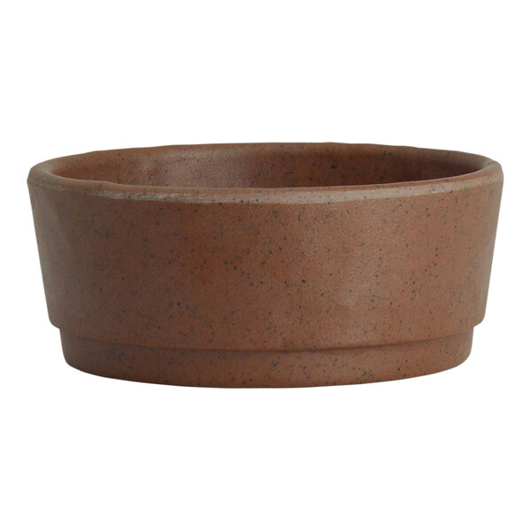 A redwood melamine round ramekin with specks on a white background.