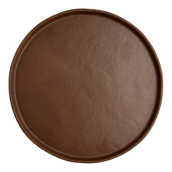 A close-up of a Creations Cali Redwood melamine plate with a circular design on a brown surface.