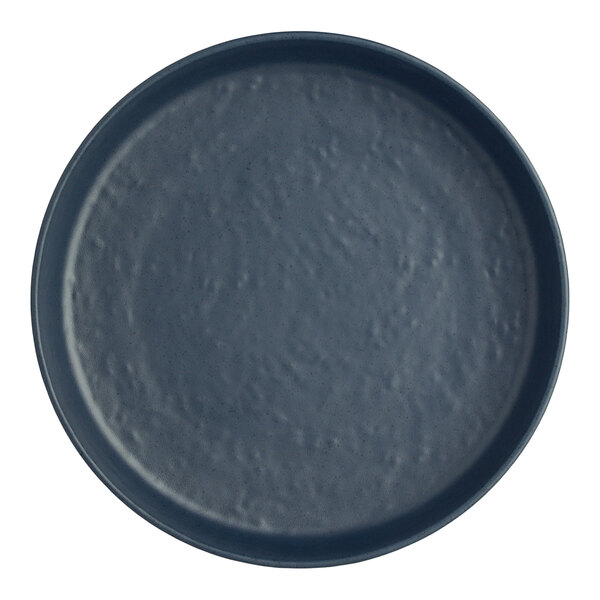 A close-up of a dark blue Creations Cali Harbor Melamine Plate with a small hole in the middle.