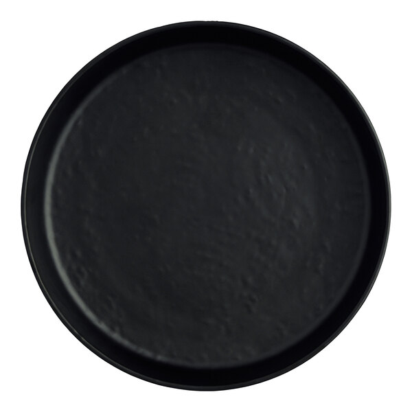 A close up of a black round Creations Cali melamine plate.